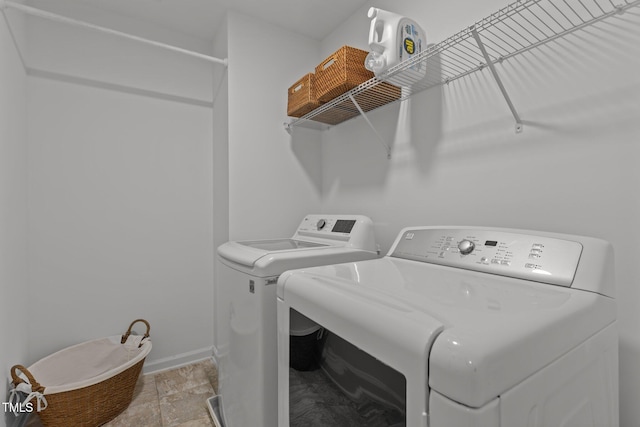 9302 Nellman Ln, Raleigh, NC 27617 - laundry room with washing machine and clothes dryer and baseboards