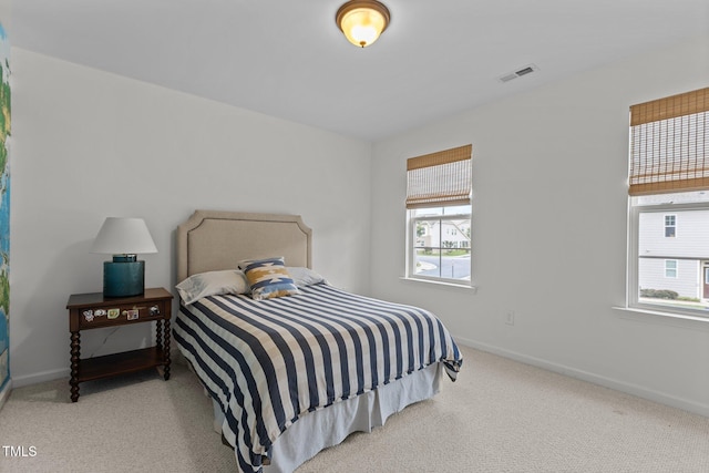 9302 Nellman Ln, Raleigh, NC 27617 - bedroom featuring multiple windows and carpet flooring