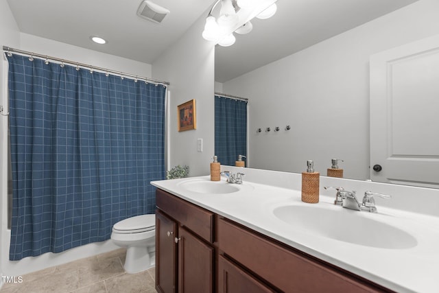 9302 Nellman Ln, Raleigh, NC 27617 - bathroom with double vanity, curtained shower, and tile patterned floors