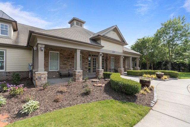 9302 Nellman Ln, Raleigh, NC 27617 - craftsman inspired home with covered porch and brick siding