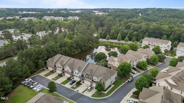 9302 Nellman Ln, Raleigh, NC 27617 - aerial perspective of suburban area with a large body of water and a heavily wooded area