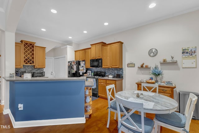 12227 Orchardgrass Ln, Raleigh, NC 27614 - kitchen featuring black appliances, backsplash, light wood finished floors, crown molding, and recessed lighting