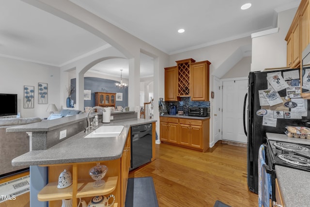 12227 Orchardgrass Ln, Raleigh, NC 27614 - kitchen featuring black appliances, open shelves, arched walkways, open floor plan, and a chandelier