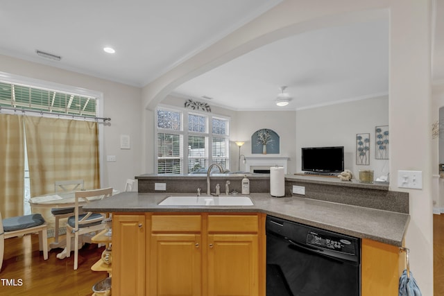 12227 Orchardgrass Ln, Raleigh, NC 27614 - kitchen with dishwasher, open floor plan, wood finished floors, arched walkways, and ornamental molding