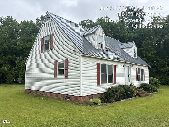13015 Hobbton Hwy, Newton Grove, NC 28366 - view of front of house featuring crawl space, a metal roof, and a front lawn