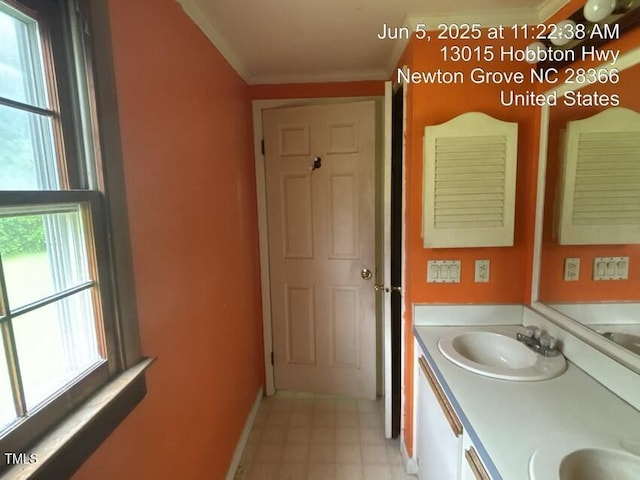 13015 Hobbton Hwy, Newton Grove, NC 28366 - bathroom featuring double vanity, ornamental molding, and tile patterned floors
