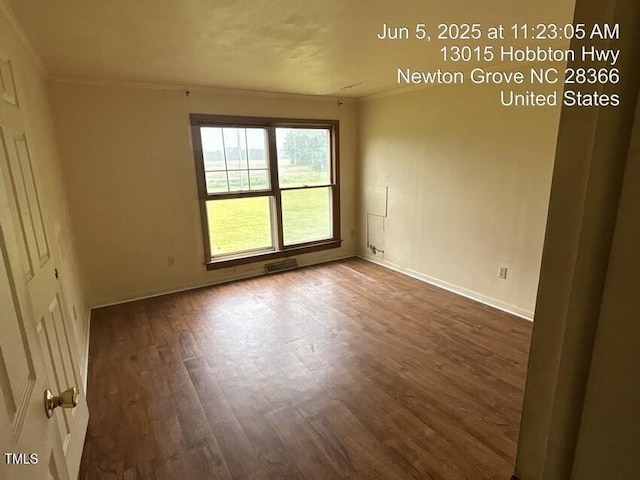 13015 Hobbton Hwy, Newton Grove, NC 28366 - empty room featuring crown molding and wood finished floors