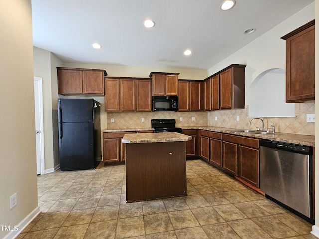 711 Keystone Park Dr Unit 78, Morrisville, NC 27560 - kitchen featuring black appliances, a center island, tasteful backsplash, light stone countertops, and recessed lighting