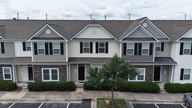 711 Keystone Park Dr Unit 78, Morrisville, NC 27560 - townhome / multi-family property with stone siding, uncovered parking, and a shingled roof