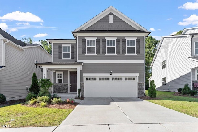 4940 Enlightenment Rd, Raleigh, NC 27616 - craftsman-style house with stone siding, a front lawn, a garage, concrete driveway, and a porch