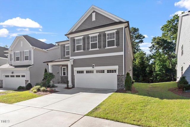 4940 Enlightenment Rd, Raleigh, NC 27616 - view of front facade featuring stone siding, a garage, driveway, and a front lawn