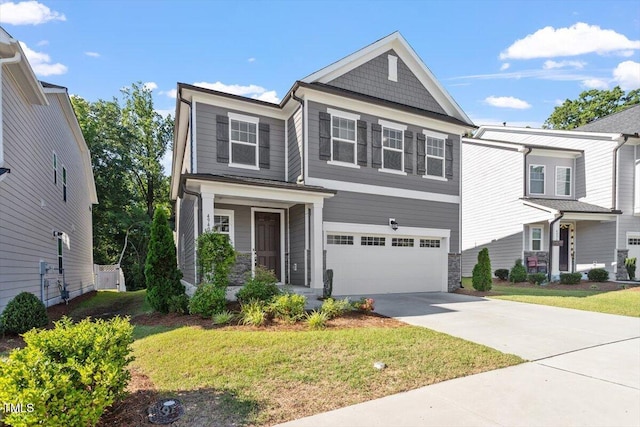 4940 Enlightenment Rd, Raleigh, NC 27616 - view of front of home featuring concrete driveway, a garage, a front lawn, and stone siding