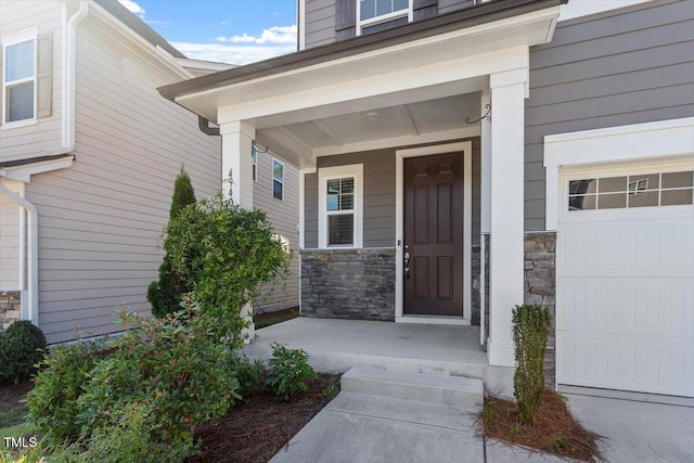 4940 Enlightenment Rd, Raleigh, NC 27616 - doorway to property featuring stone siding and covered porch