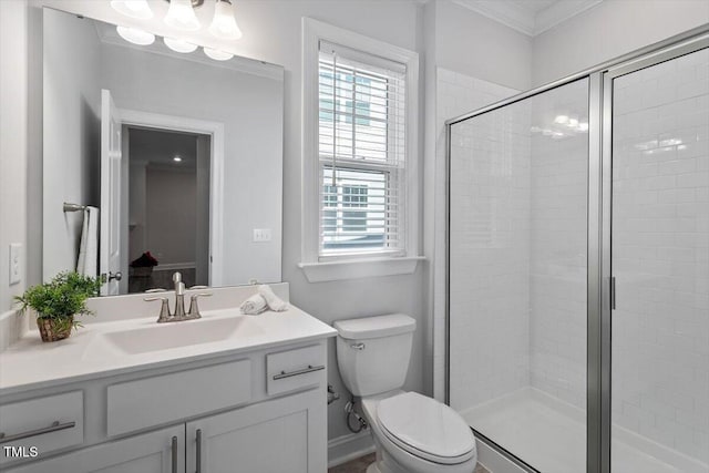 4940 Enlightenment Rd, Raleigh, NC 27616 - bathroom featuring vanity, healthy amount of natural light, a shower stall, and crown molding