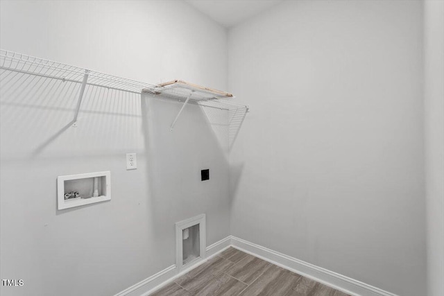 4940 Enlightenment Rd, Raleigh, NC 27616 - laundry room featuring hookup for an electric dryer, washer hookup, and wood finished floors