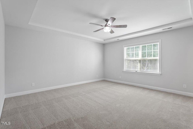 4940 Enlightenment Rd, Raleigh, NC 27616 - unfurnished room with a raised ceiling, a ceiling fan, and carpet floors