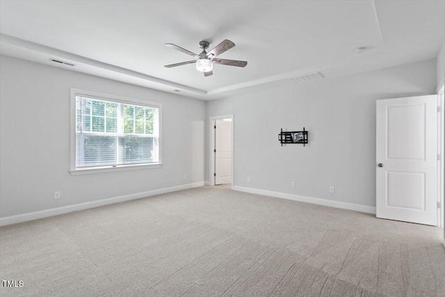 4940 Enlightenment Rd, Raleigh, NC 27616 - spare room with a ceiling fan, light colored carpet, and a raised ceiling