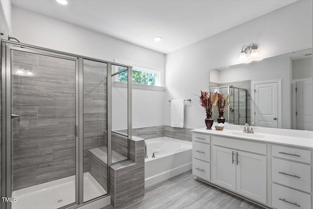 4940 Enlightenment Rd, Raleigh, NC 27616 - full bathroom with vanity, a bath, a shower stall, and recessed lighting