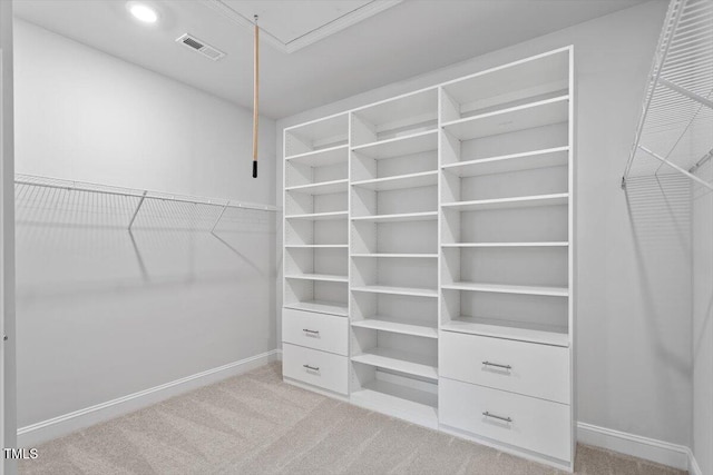 4940 Enlightenment Rd, Raleigh, NC 27616 - spacious closet featuring light carpet and attic access