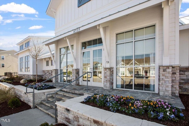 4940 Enlightenment Rd, Raleigh, NC 27616 - property entrance featuring stone siding and board and batten siding