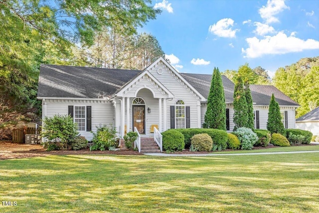 1819 Umstead Rd, Durham, NC 27712 - view of front of house featuring a front yard and a shingled roof