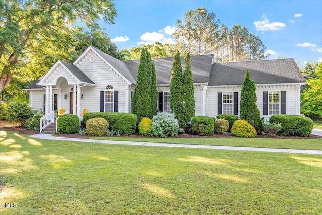1819 Umstead Rd, Durham, NC 27712 - view of front of home with a front yard and a shingled roof
