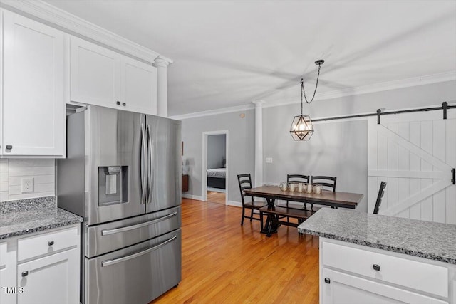 1819 Umstead Rd, Durham, NC 27712 - kitchen with stainless steel fridge with ice dispenser, crown molding, light wood-style floors, white cabinets, and tasteful backsplash