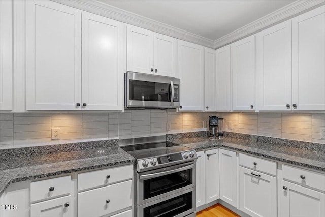 1819 Umstead Rd, Durham, NC 27712 - kitchen with stainless steel appliances, white cabinets, and ornamental molding