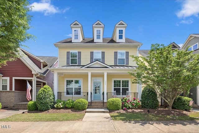 1330 Rodessa, Raleigh, NC 27607 - view of front facade featuring a standing seam roof, covered porch, and a metal roof