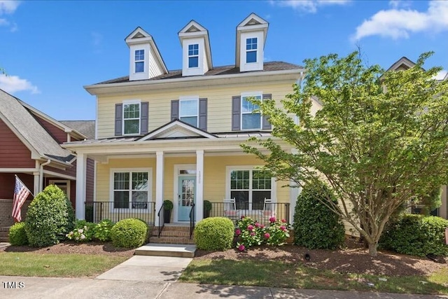 1330 Rodessa, Raleigh, NC 27607 - view of front of house with a standing seam roof, a porch, and a metal roof