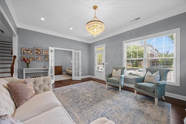 1330 Rodessa, Raleigh, NC 27607 - living area featuring a chandelier, crown molding, dark wood-style floors, french doors, and recessed lighting