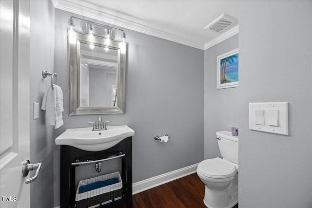 1330 Rodessa, Raleigh, NC 27607 - bathroom featuring wood finished floors, vanity, and ornamental molding