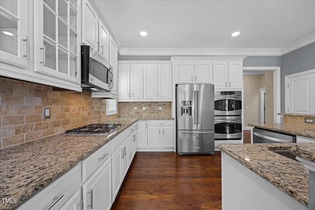 1330 Rodessa, Raleigh, NC 27607 - kitchen with appliances with stainless steel finishes, ornamental molding, white cabinets, glass insert cabinets, and dark wood-style floors