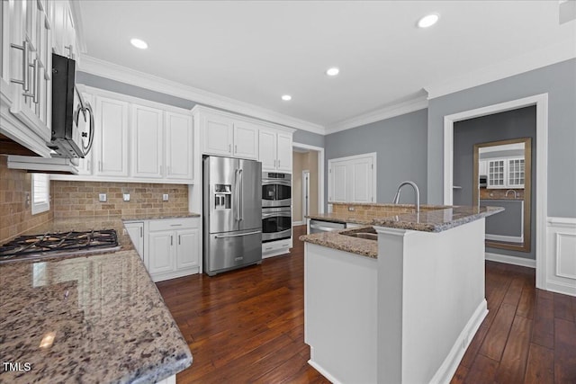 1330 Rodessa, Raleigh, NC 27607 - kitchen with stainless steel appliances, dark wood-style floors, light stone countertops, white cabinets, and crown molding
