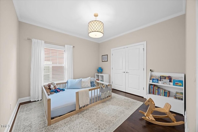 1330 Rodessa, Raleigh, NC 27607 - bedroom featuring wood finished floors, crown molding, and a closet