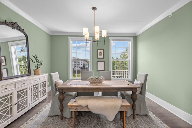 10310 Sablewood Dr Unit 211, Raleigh, NC 27617 - dining space with a chandelier, ornamental molding, and wood finished floors