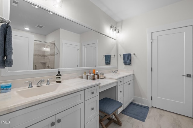 10310 Sablewood Dr Unit 211, Raleigh, NC 27617 - bathroom featuring double vanity and a shower stall