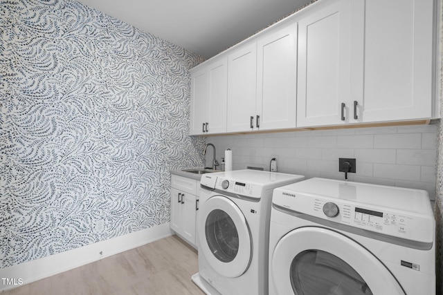 10310 Sablewood Dr Unit 211, Raleigh, NC 27617 - laundry area with cabinet space, washer and dryer, and wallpapered walls