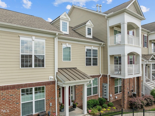 10310 Sablewood Dr Unit 211, Raleigh, NC 27617 - view of property with roof with shingles and brick siding