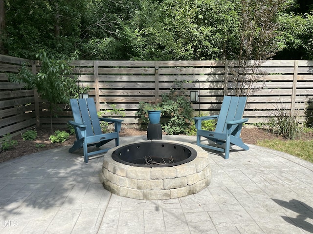 517 Bart St, Raleigh, NC 27610 - fenced backyard featuring an outdoor fire pit and a patio