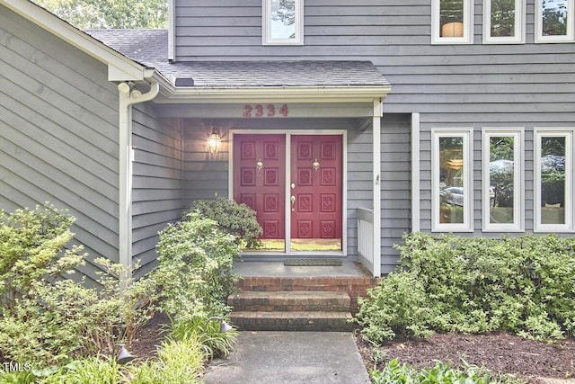 2334 Dawn Trl, Durham, NC 27712 - doorway to property featuring roof with shingles