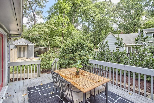 2334 Dawn Trl, Durham, NC 27712 - deck with a fenced backyard, a storage shed, and outdoor dining area