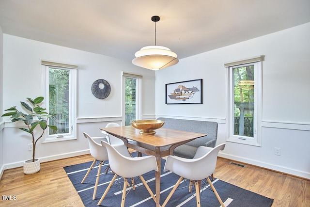 2334 Dawn Trl, Durham, NC 27712 - dining space with healthy amount of natural light and wood finished floors