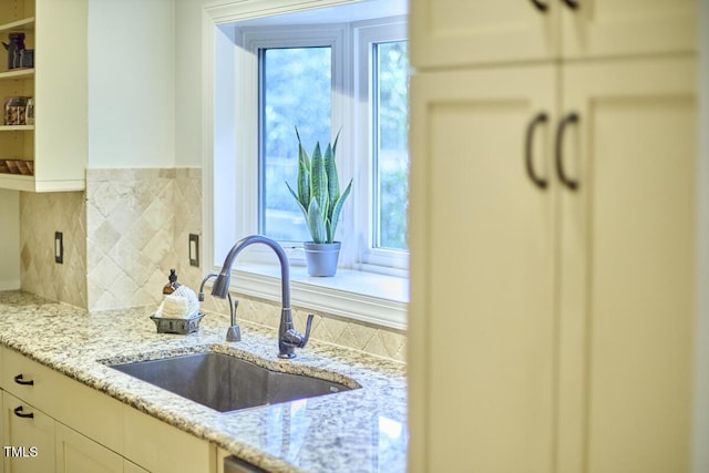 2334 Dawn Trl, Durham, NC 27712 - kitchen featuring healthy amount of natural light, white cabinetry, light stone countertops, and open shelves