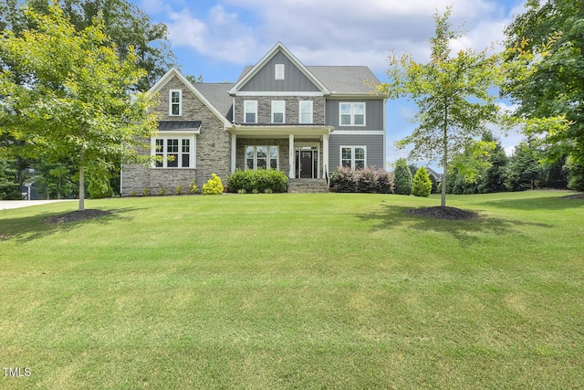 1625 Banks View Dr, Raleigh, NC 27603 - craftsman-style home with stone siding, a front yard, and board and batten siding