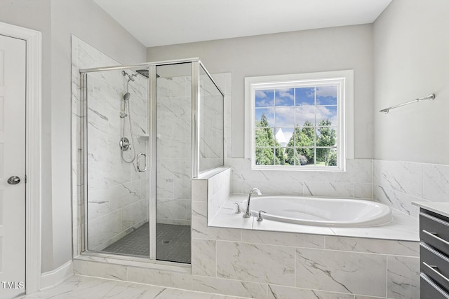 1625 Banks View Dr, Raleigh, NC 27603 - bathroom featuring a garden tub, marble look tile flooring, and a marble finish shower