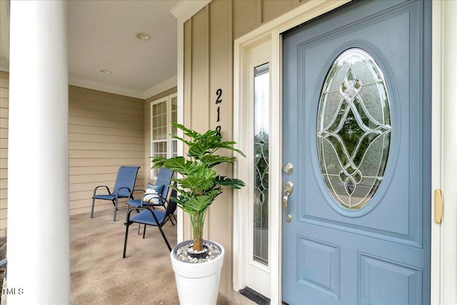 218 Kinvara Ct, Wake Forest, NC 27587 - doorway to property with board and batten siding and covered porch