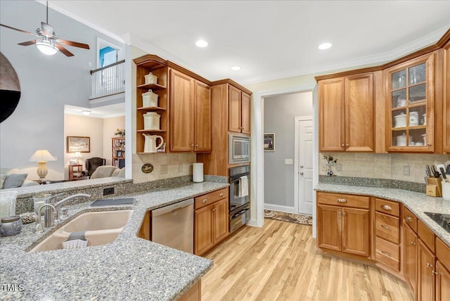 218 Kinvara Ct, Wake Forest, NC 27587 - kitchen featuring appliances with stainless steel finishes, open floor plan, a warming drawer, open shelves, and light wood-type flooring