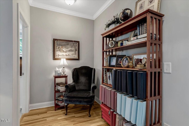 218 Kinvara Ct, Wake Forest, NC 27587 - sitting room with light wood finished floors and crown molding
