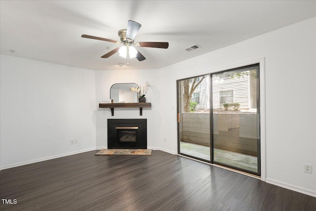 600 Audubon Lake Dr Unit 4B11, Durham, NC 27713 - unfurnished living room featuring dark wood-style floors, a fireplace with flush hearth, and a ceiling fan